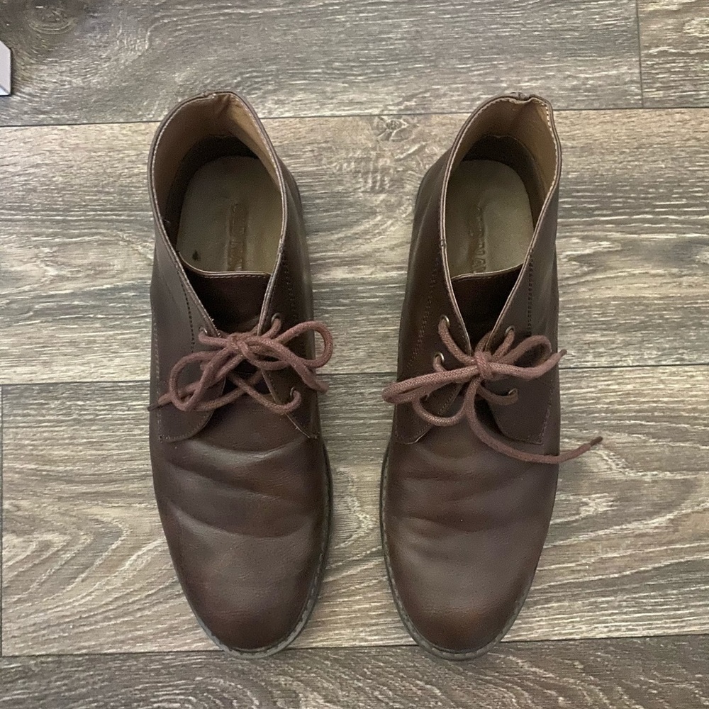 Brown faux leather chukkah boots.